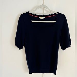 Stylish navy blue boden shirt with wavy cuts on neck and sleeves